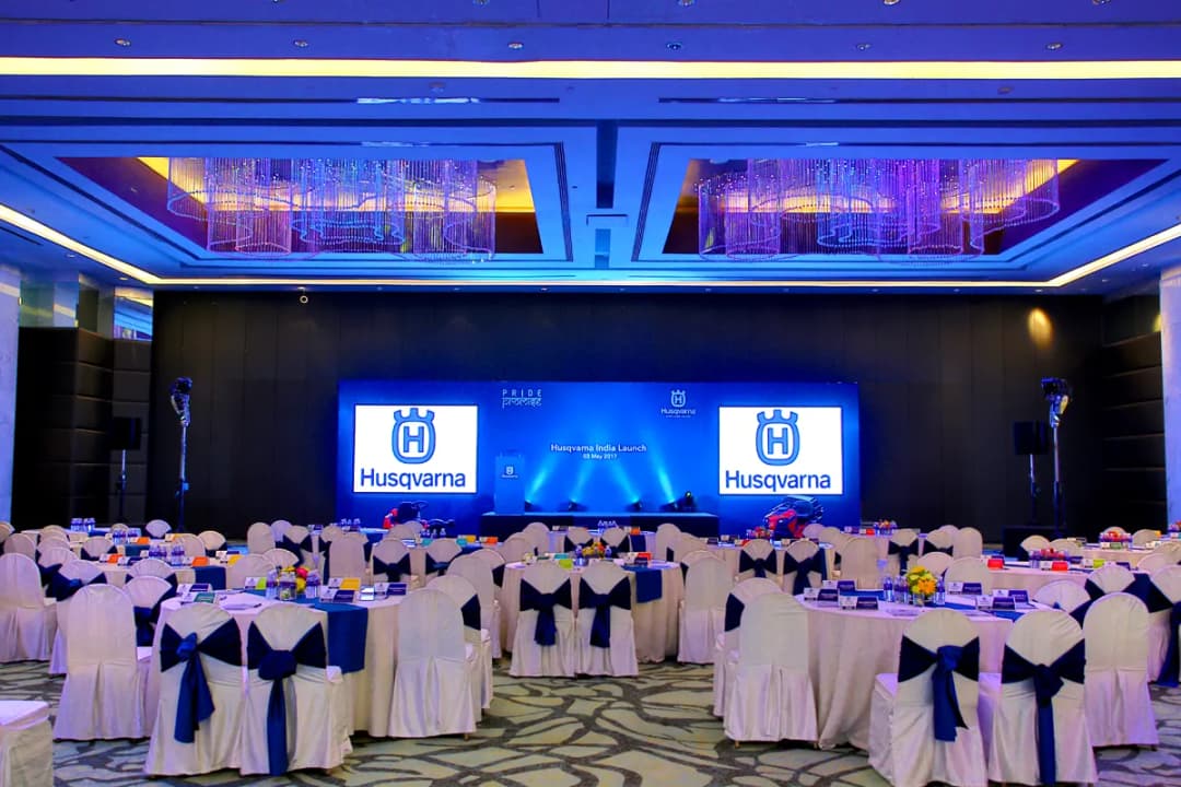 Corporate seminar with Husqvarna branding and decorated banquet hall
